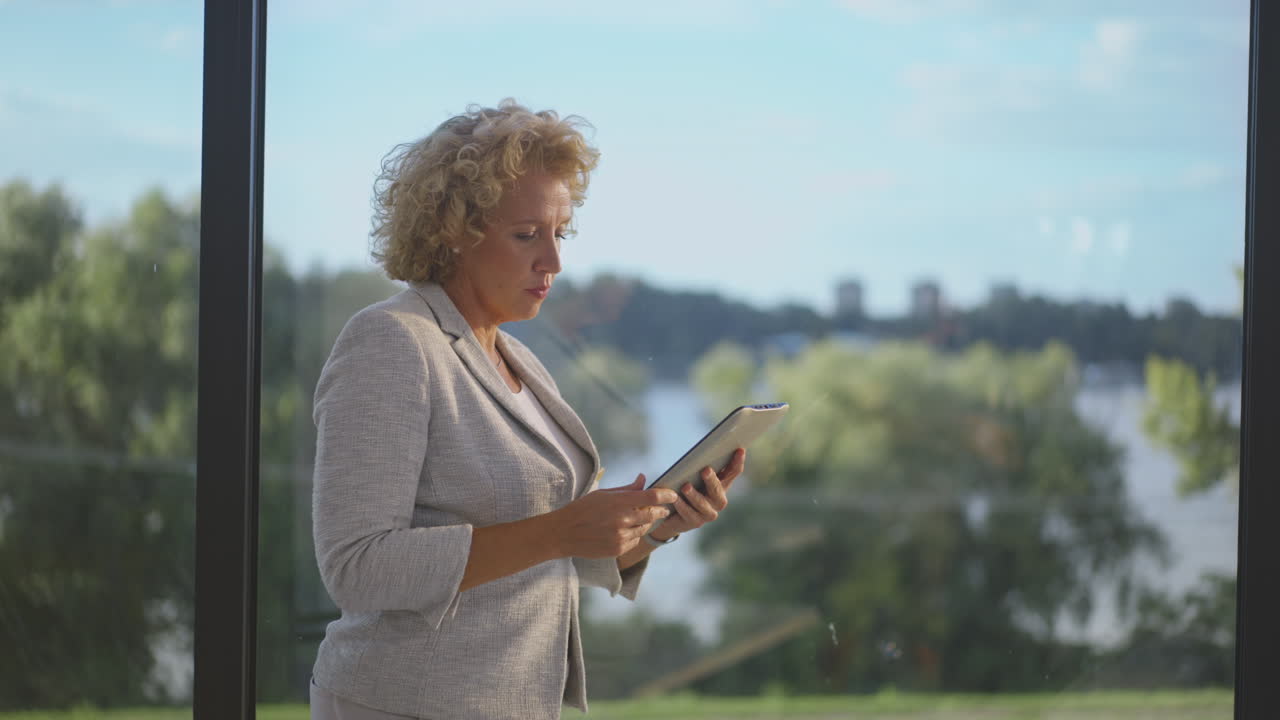Woman using tablet outdoors