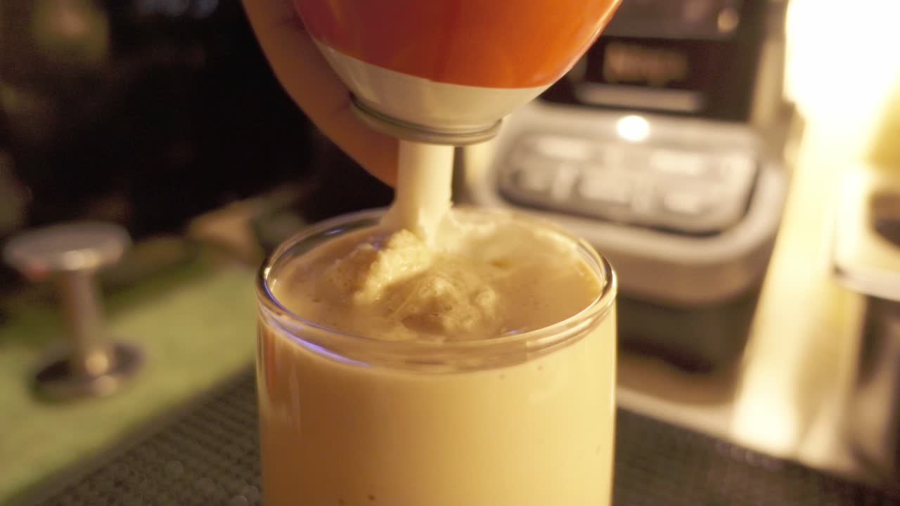 Whipped cream on milkshake with soft lighting, cozy and indulgent feel