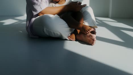 mother and child sitting on the floor