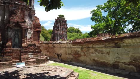 static shot: buddhist temple at the old the historic city of ayutthaya thailand which looks like it is falling over