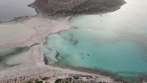 aerial footage of paradisiac balos beach and lagoon near gramvousa island with azure clear water in crete, greece