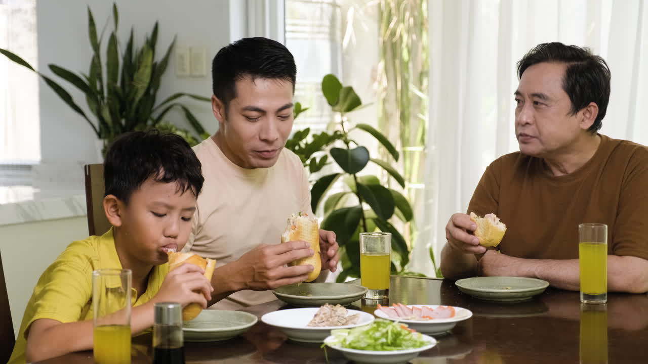 Asian Men And Boy Sitting At The Table Free Stock Video Footage Download  Clips