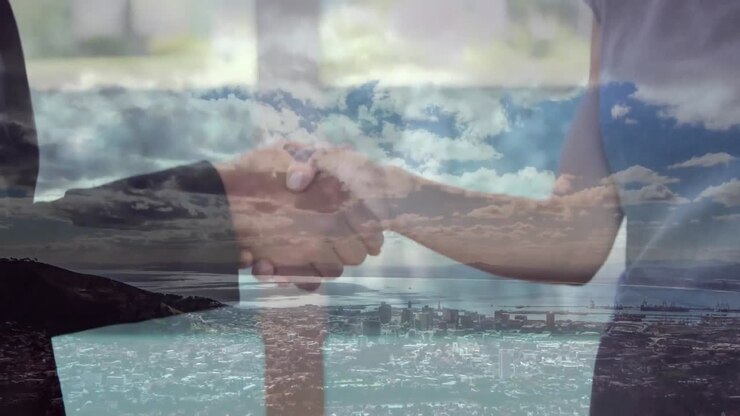 Animation of businessman handshake over cityscape