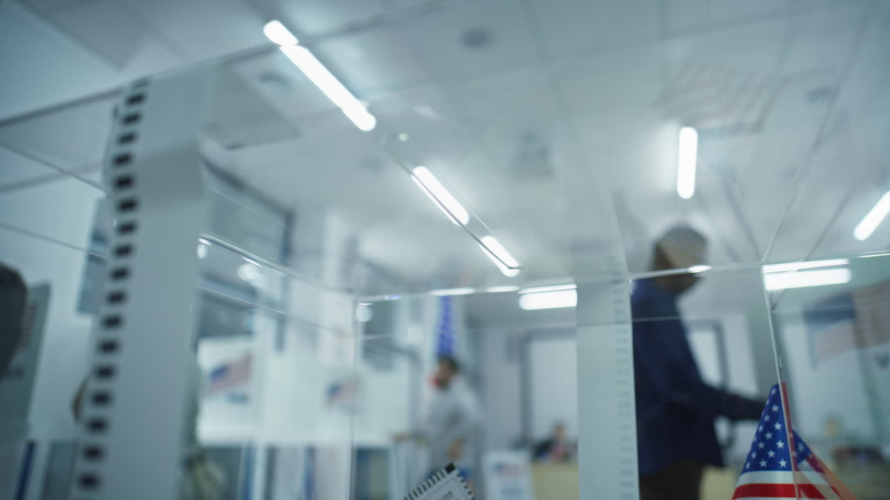 African American Man Puts Voting Bulletin Paper in Box African American Man Puts Bulletin Paper in Box Multiethnic Voters us Citizens Vote in Voting Booths at Polling Station National Election Day in the United States Civic Duty and Democracy Concept