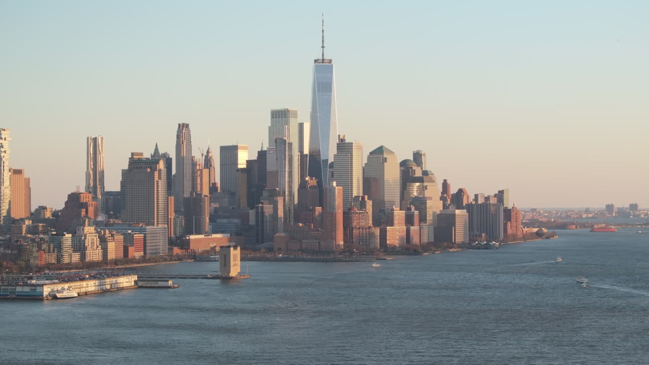 Aerial view of The World Trade Center at dusk. Shot along The Hudson River in New Jersey.