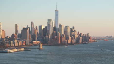aerial view of the world trade center at dusk. shot along the hudson river in new jersey.