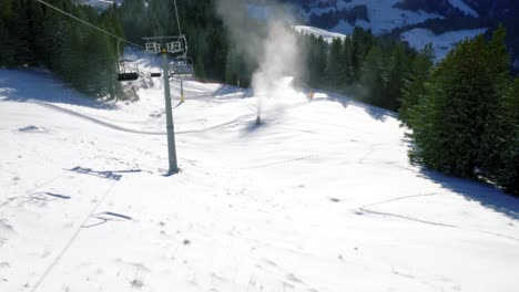 ice flyers, cable cars, and chair lifts going up an down the snowy slopes of a skiing destination located at engelberg, in brunni, switzerland