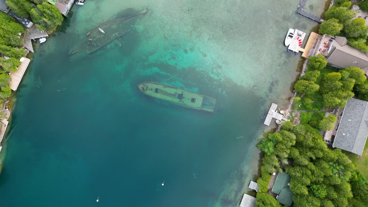 Aerial View of Two Historic Shipwrecks Submerged in Clear Waters