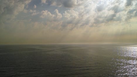 sea view with sun rays breaking through the clouds