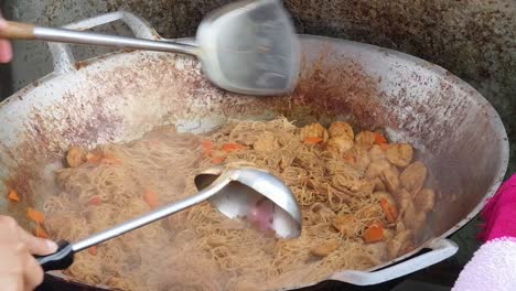 Stir-fried Noodles Being Prepared in a Wok