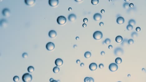 Many-water-bubbles-in-blue-water-close-up,-abstract-water-wave-with-bubbles-in-slow-motion.