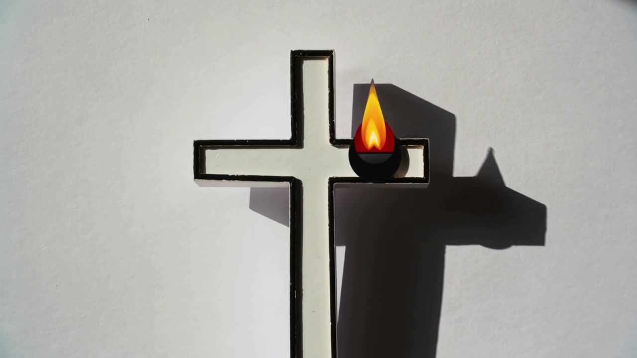 Shifting sunlight on cross ornament lengthening shadow on white wall, sharpening flame silhouette