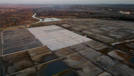 cinematic drone flight next to a salt field in croatia in nin at twilight