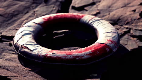 very old abandoned grungy lifebuoy