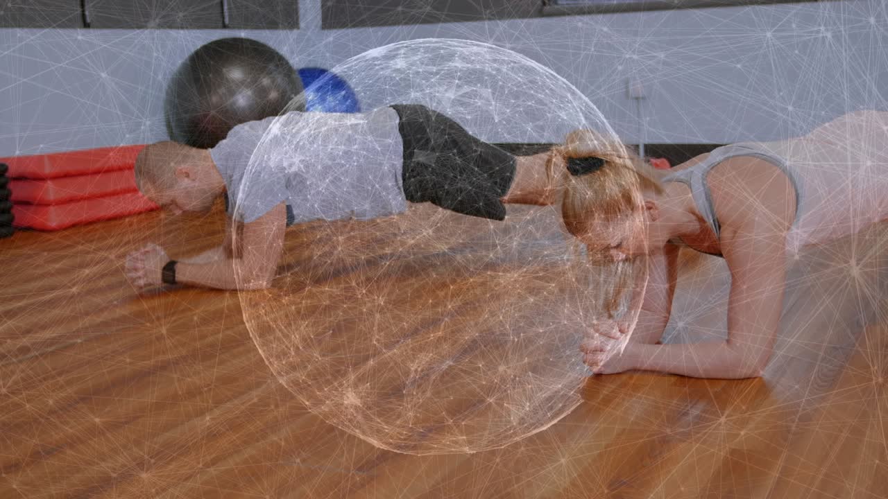 Two partners holding forearm plank while sphere overlay overlapping them, shifting form for fitness