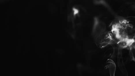 Abstract-black-and-white-smoke-with-a-black-background-in-slow-motion