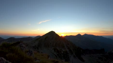 sunset over high peaks in pirin mountain.  plain trail in the blue sky. clouds, light wind. view of gazey peak at summer evening. time lapse.