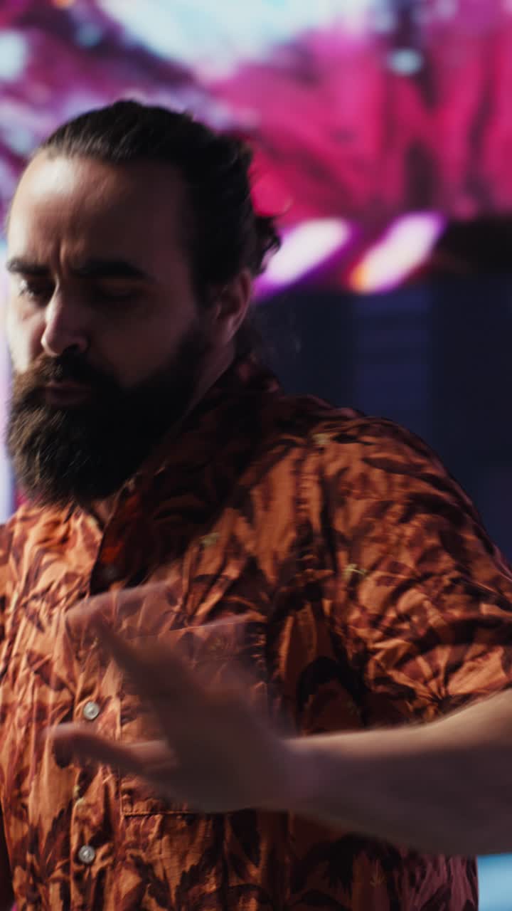 Vertical Video DJ influencer dancing around the club with electronic beats and artistic visuals