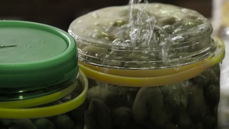 filling-table-olive-jars-with-water