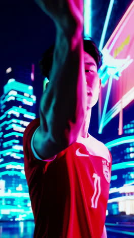 soccer player in a city at night