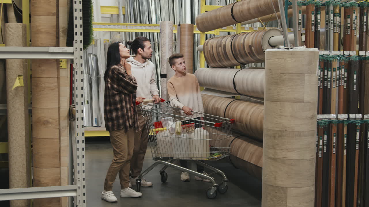 Family Shopping for Linoleum at Home Improvement Store