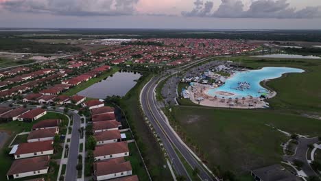 southshore bay lagoon in suburb of sun city with luxury mansions in neighborhood. aerial wide shot. turquoise water at waterpark of florida, usa. sunny day in summer