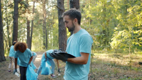 volunteers cleaning up a forest