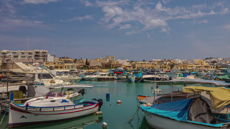 colored fishing boats in harbour of marsaxlokk port, malta island time-lapse