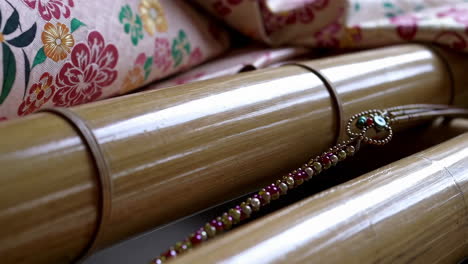 decorative bamboo structure with beads and kimono fabric