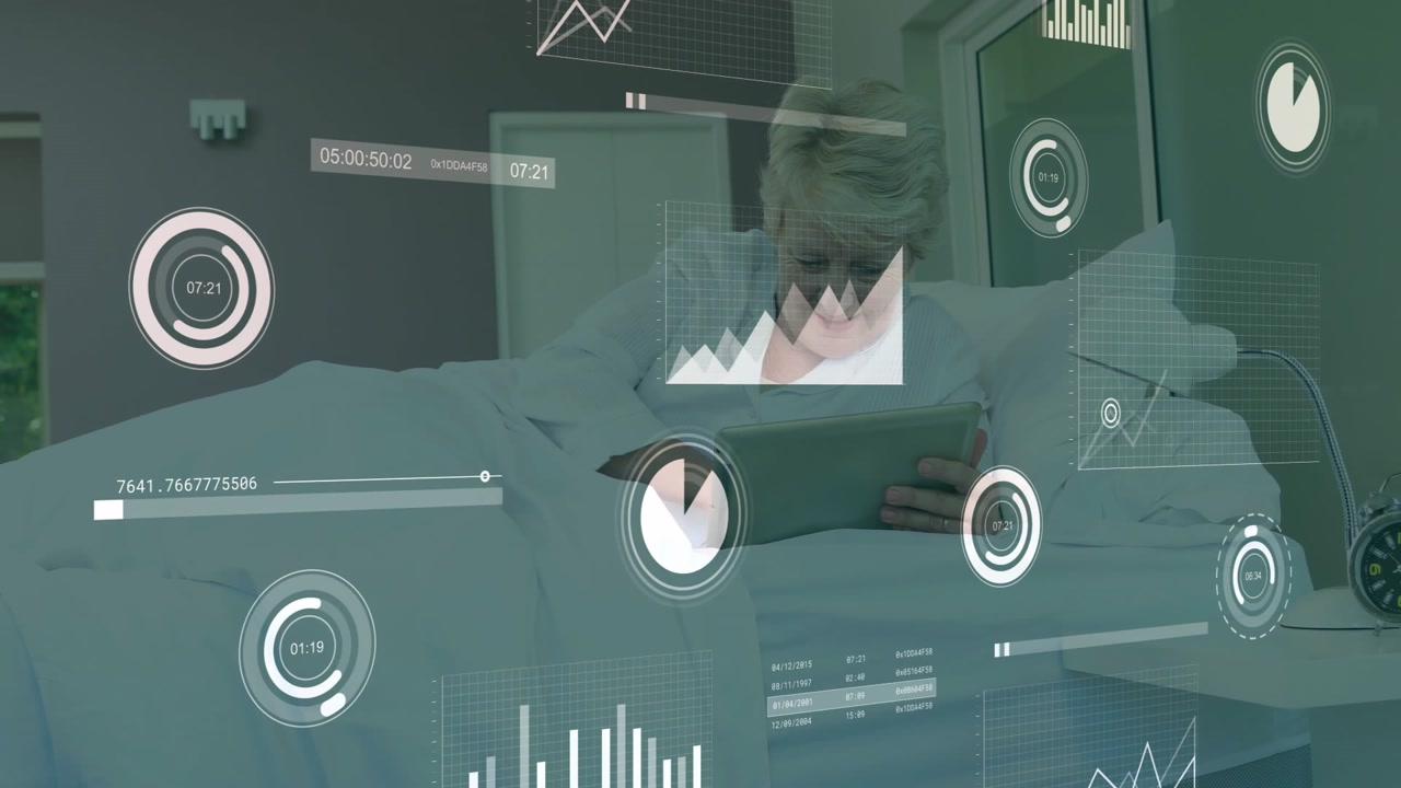 Senior woman reclining on bed, viewing financial data charts floating around tablet screen