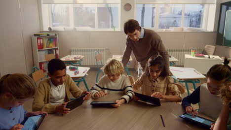 students doing class work on digital tablets. pupils using tablet computers