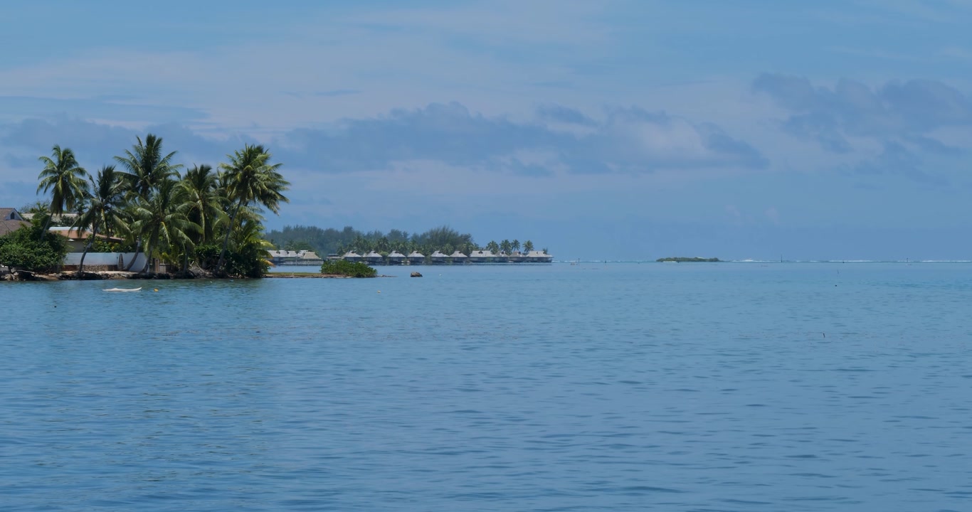 Overwater wooden bungalows in Moorea, French Polynesia.