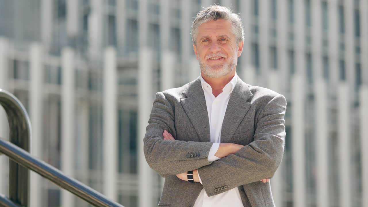 Portrait of a Smiling Middle-Aged Businessman Outdoors