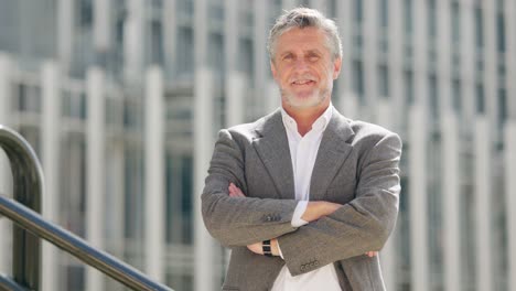 portrait of a smiling middle-aged businessman outdoors