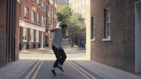 Contemporary-funky-mixed-race-man-street-dancer-dancing-freestyle-in-the-city