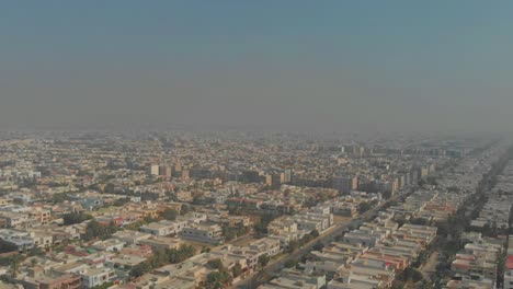 aerial view of clifton cantonment in karachi, pakistan with smog in the air