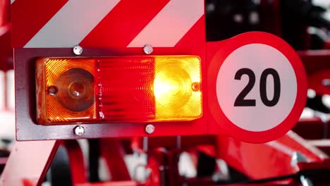 Red-and-white-striped-road-warning-post-with-orange-beacons.-Sign-and-lights