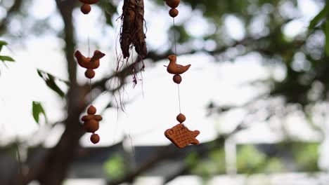 decorative fish mobile swaying in the breeze