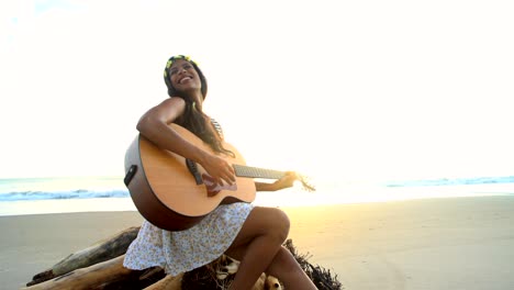 indian american girl wearing retro dress playing guitar