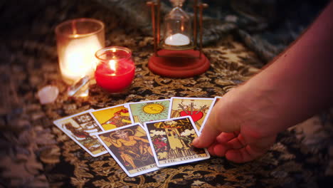 a mystical fortune teller lays out a tarot card spread