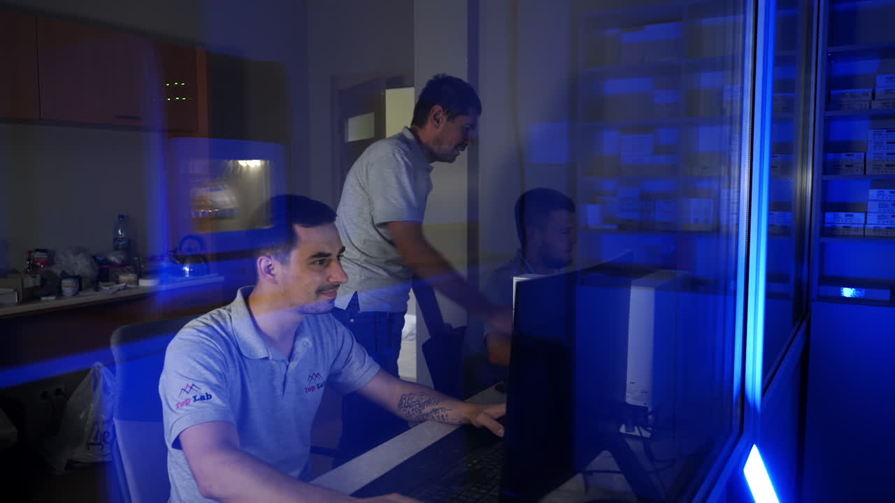 Dental technician making crowns. Persons working on computer with dental software platform for make dental prosthesis