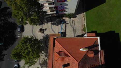 Aerial-drone-view-of-neighbourhood-in-Lisbon,-Portugal-with-orange-roof