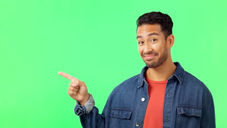 Face,-man-and-hand-pointing-to-green-screen-studio