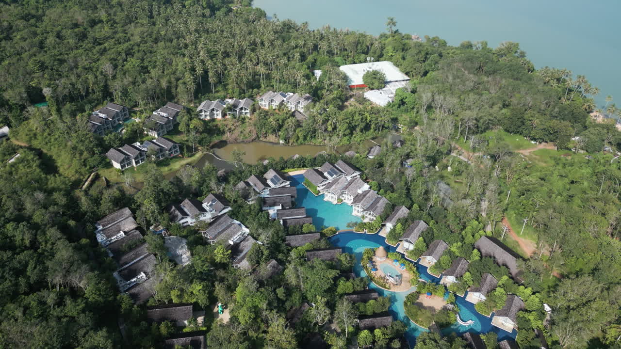 Aerial view of island resorts with sandy beaches and clear ocean waves
