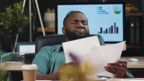 Closeup-exhausted-african-american-businessman-yawning-in-hipster-office