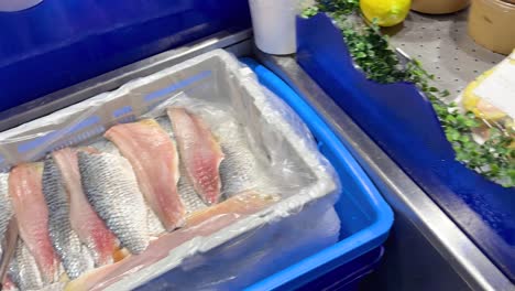 variety of fresh fish fillets on display