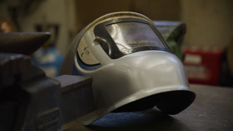 welding mask on a welding table in a classroom