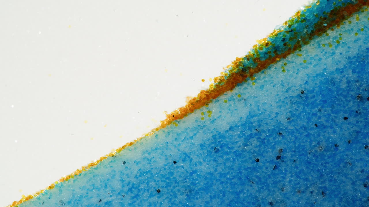 Close-up of mixed blue and orange granular material