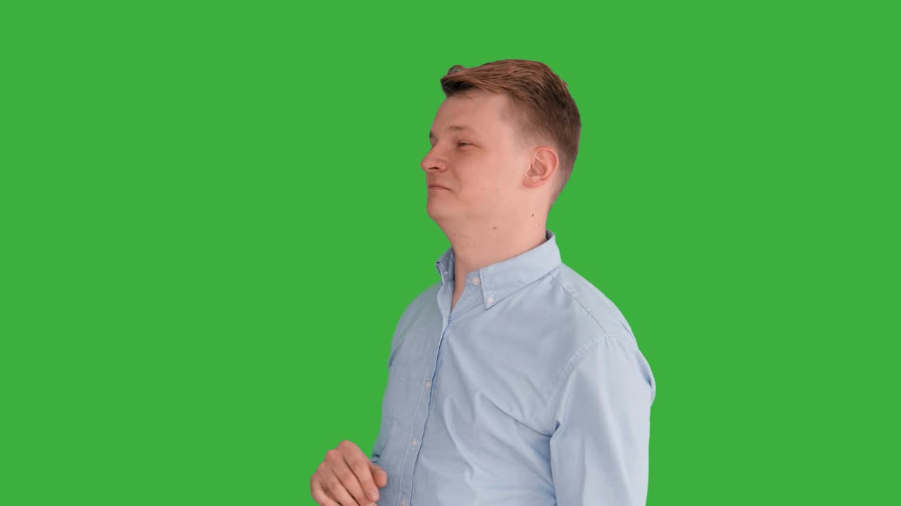Young Handsome Men Acting in Front of a Green Screen. Blond Hair, Blue Shirt and Blue Trousers. Dancing, Thinking, Turning Around and Talking to the Camera.