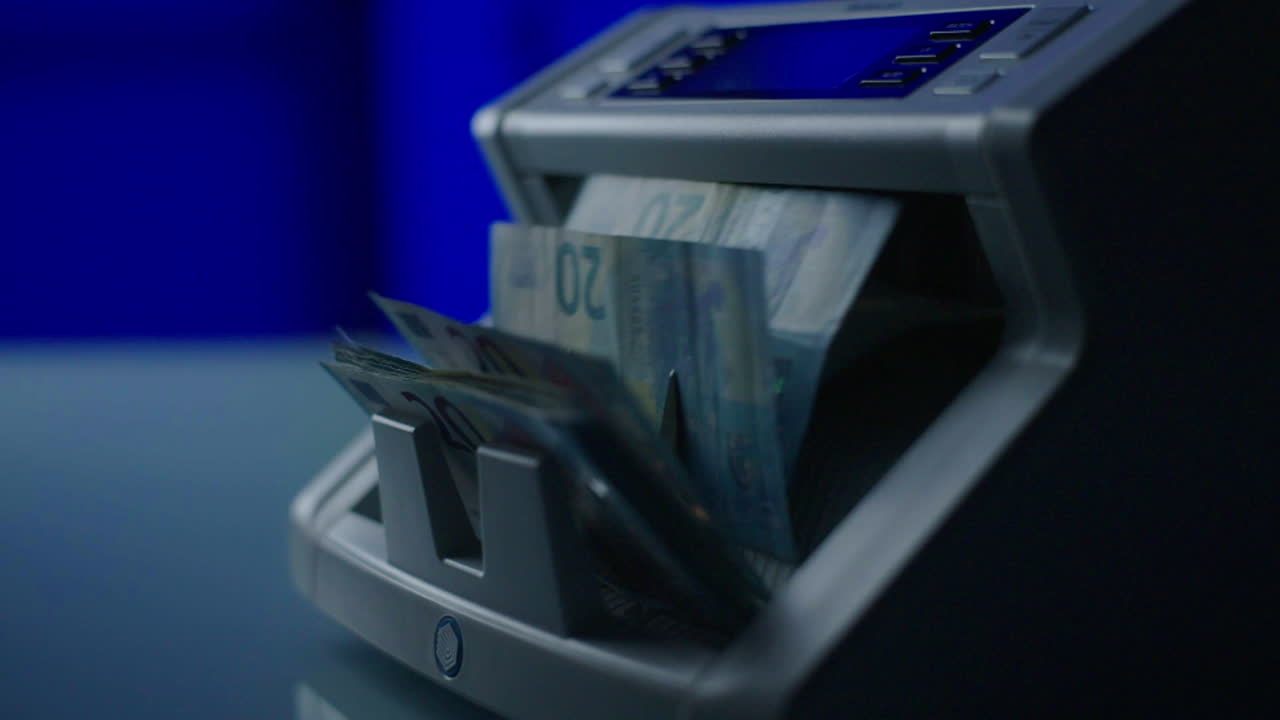 Euro Banknotes being Processed by a Counting Machine